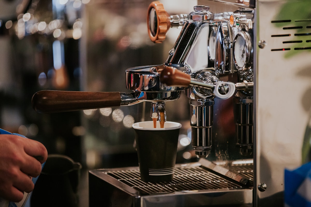 Espresso machine pouring a shot into a cup