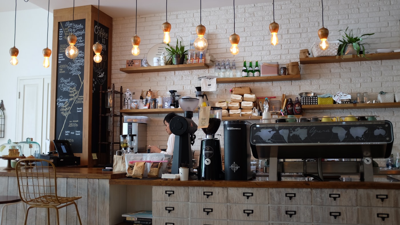 Bright café interior with espresso bar and barista