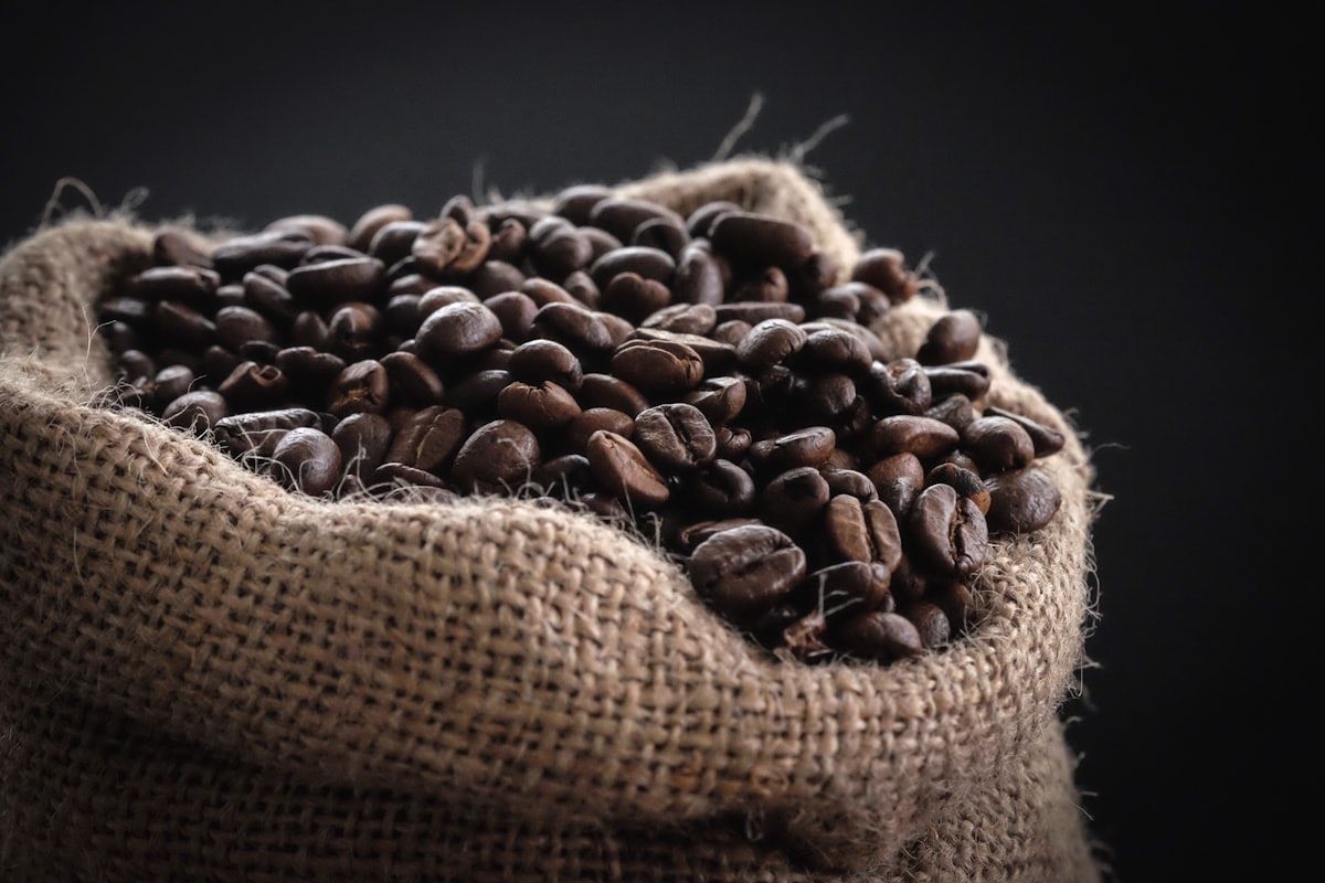 Roasted coffee beans in a burlap sack